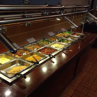 a variety of food in a buffet