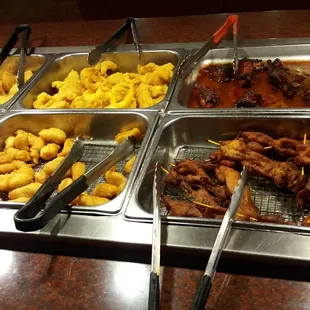 a variety of food items in trays