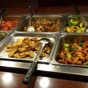 a variety of food items in a buffet