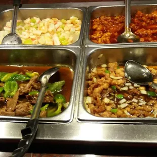 a variety of food items in a buffet