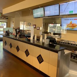 the counter and menus of the restaurant