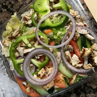 $12.99 for this grilled chicken salad. Spot the chicken. There isn't a whole breast here.