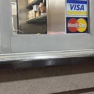 Employee takes payment sits on the counter on his cell phone. Sign says NO CELL PHONE WHILE ON THE CLOCK. So unprofessional.