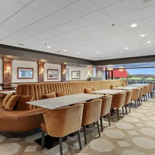 seating area with tables and chairs