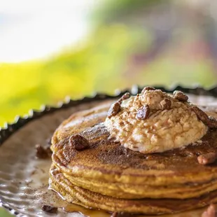 a stack of pancakes with ice cream on top
