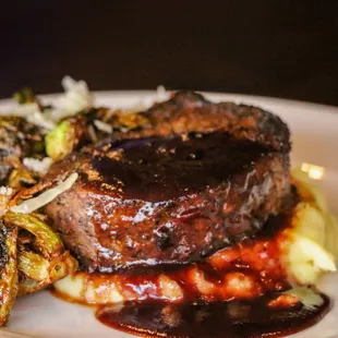 a plate of meat and vegetables