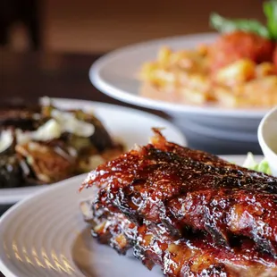 a plate of ribs and sides