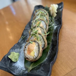 a plate of sushi on a table