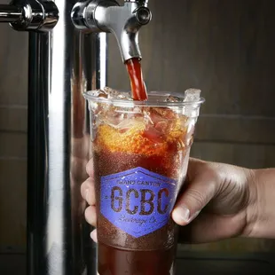 a person pouring a drink