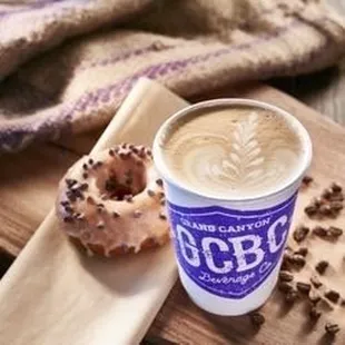 a cup of coffee and a doughnut