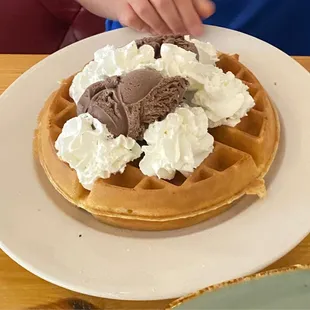 Waffle with ice cream and whipped cream