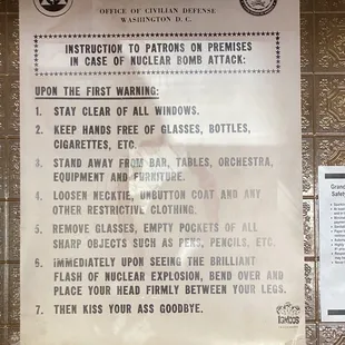 Funny fallout shelter sign next to grill