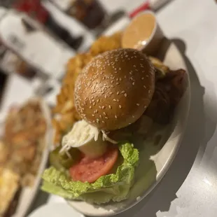 a hamburger and fries on a plate