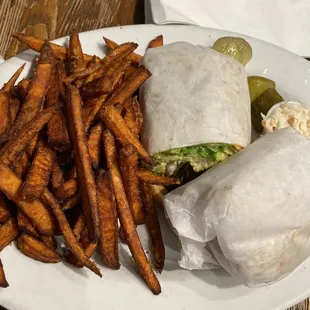 a burrito and sweet potato fries