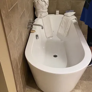 Our tub in our suite. It came with a robe and bath crystals to use.