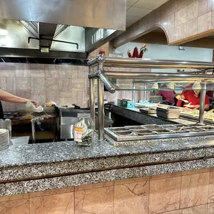 a man preparing food in a restaurant