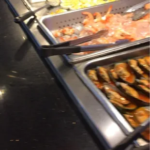 Part of a buffet line. There is about 10 of these tables set up!