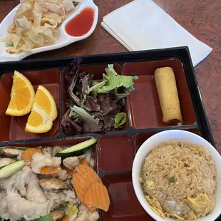 a bento box with a variety of food items