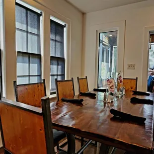 a large wooden table and chairs