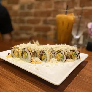 a plate of sushi rolls