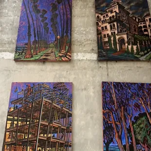 four paintings on a wall