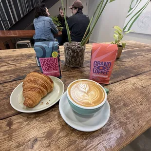 Cappuccino and croissant and whole bean coffee