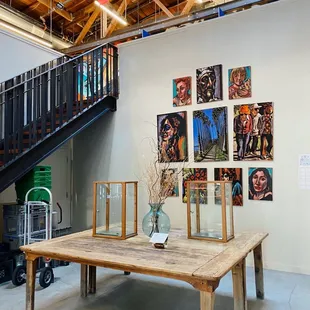 a wooden table and a staircase