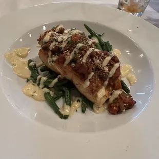 Salmon with chorizo over green beans with aioli