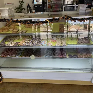 a display case filled with donuts