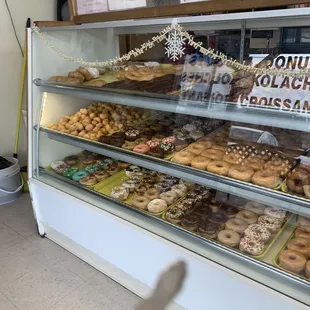 a display case full of doughnuts