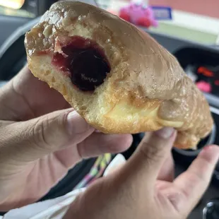 Maple glazed long John filled with raspberry