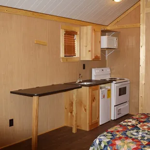 Full Kitchenette with full range stove,oven,microwave, refrigerator, cabinets,sink and dinning table.