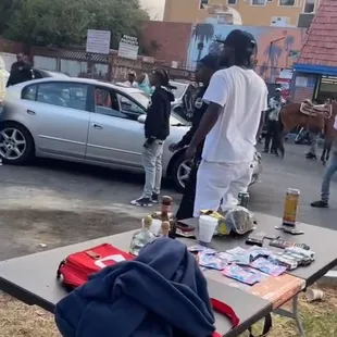 Guy casually selling marijuana in the parking lot
