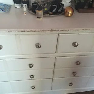 Furniture peeling for no reason. Not made of wood. Looks like some sort of fiber based compound.