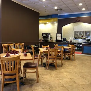 a restaurant with tables and chairs