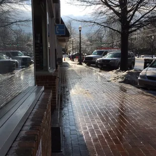 Winter shot , clean Sidewalk after a fresh rain in the morning, then comes the Sun.