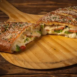 a close up of a pizza cut in half