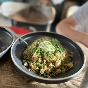 Bacon fried rice with poached egg. On the saltier side but tasty