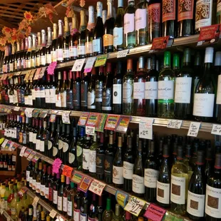 rows of bottles of wine on shelves