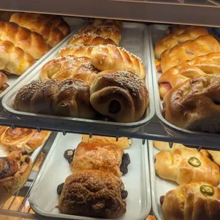 Hot dog pastry with sesame seeds, ham and cheese pastry, ham and cheese and jalapeno pastry, and chocolate croissants, Jan 8, 2024