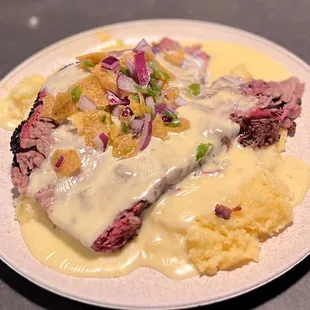 EL BORRACHO: Texas style brisket smothered with queso and Frito serrano relish.  I know, I know. Just try it!