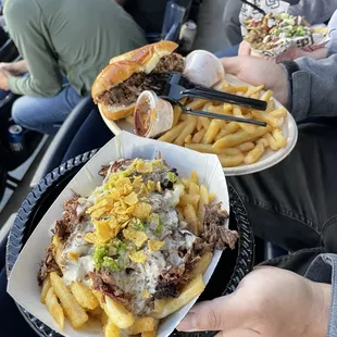 Left: El Borracho Cheese Fries with added smoked brisket- I highly recommend it!   Right: Pulled Pork Sandwich