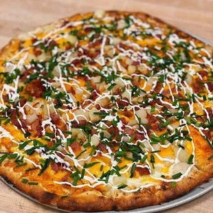 a pizza with cheese and bacon