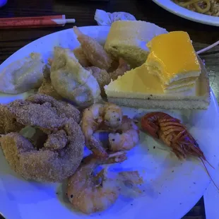 Crawfish, fried fish(the type was specified), the small orange dessert, potstickers, fried shrimp, jalapeño fried shrimp.