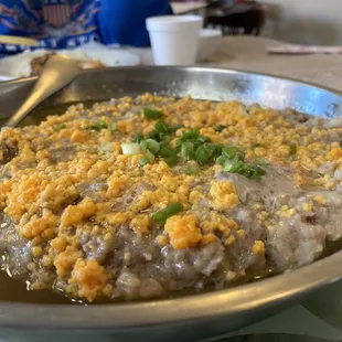 Steamed pork cake (like meatloaf) with preserved duck egg yolk