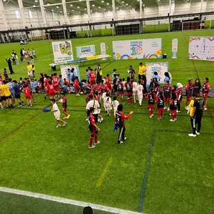 People gathering up for the closing ceremony inside the main building.