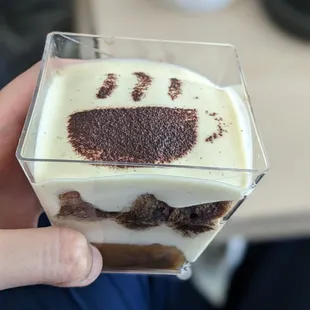 a hand holding a dessert