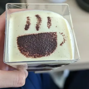 a hand holding a dessert