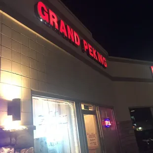 the front of the restaurant at night