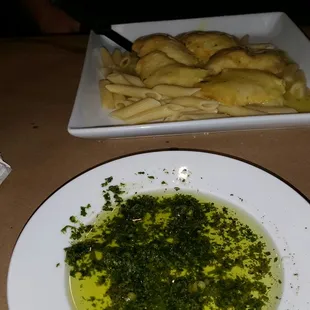 Pesto and oil for the delicious bread. My hubby's order of chicken franchese